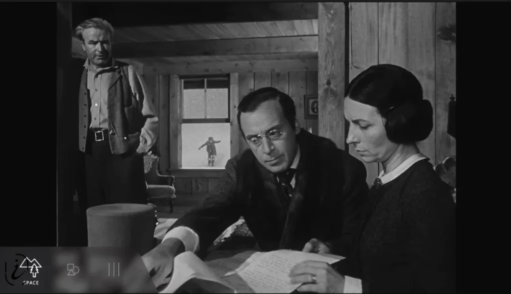 Still from Citizen Kane showing young Charles in the distant background and adults in the foreground, demonstrating depth and power dynamics.
