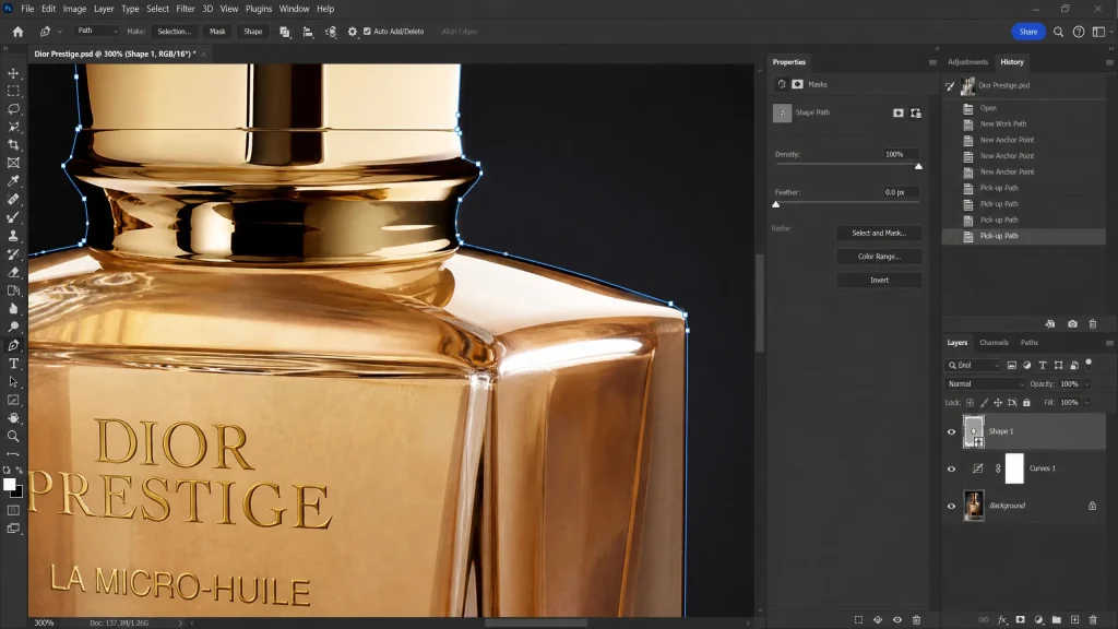 High-precision vector paths created with the Pen Tool around a luxury perfume bottle in Photoshop.